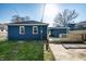Backyard featuring a deck and modern painted brick exterior at 3712 N Olney St, Indianapolis, IN 46218