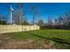 Spacious backyard features a new wooden fence and lush green grass at 3712 N Olney St, Indianapolis, IN 46218