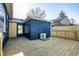 Backyard features a wooden deck and modern painted brick exterior at 3712 N Olney St, Indianapolis, IN 46218