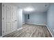 Finished basement features recessed lighting and white door with brushed hardware at 3712 N Olney St, Indianapolis, IN 46218