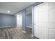 Finished basement with recessed lighting, wood floors, and white closet doors at 3712 N Olney St, Indianapolis, IN 46218