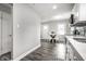 Bright kitchen with eat-in dining area and wood-look flooring at 3712 N Olney St, Indianapolis, IN 46218