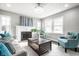 Comfortable living room with a fireplace, bright windows, and stylish decor and furnishings at 3712 N Olney St, Indianapolis, IN 46218