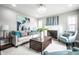 Cozy living room with fireplace, stylish furniture, and natural light from several windows at 3712 N Olney St, Indianapolis, IN 46218