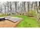 Large wooden deck with beautiful backyard and green grass for outdoor enjoyment at 381 Stoneybrook Grove Dr, Greenwood, IN 46142