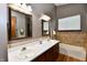 Spacious bathroom with dual sinks, well-lit mirrors, and a soaking tub at 381 Stoneybrook Grove Dr, Greenwood, IN 46142