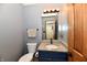 Traditional half bathroom with a granite countertop and decorative lighting above the mirror at 381 Stoneybrook Grove Dr, Greenwood, IN 46142