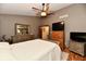 Comfortable bedroom featuring neutral tones, a ceiling fan, and a television at 381 Stoneybrook Grove Dr, Greenwood, IN 46142
