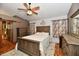 Comfortable bedroom featuring wood accents, a ceiling fan, and a well-made bed at 381 Stoneybrook Grove Dr, Greenwood, IN 46142