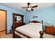 Bedroom with a wooden bed frame, decorative ceiling fan, and a wooden dresser at 381 Stoneybrook Grove Dr, Greenwood, IN 46142