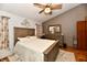 Comfortable bedroom featuring wood accents, a ceiling fan, and a decorative wall hanging at 381 Stoneybrook Grove Dr, Greenwood, IN 46142