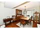 Warm dining room area featuring wooden furnishings, hardwood floors, and a decorative chandelier at 381 Stoneybrook Grove Dr, Greenwood, IN 46142