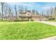 Inviting two-story home features a well-manicured lawn, and mature trees in a suburban neighborhood at 381 Stoneybrook Grove Dr, Greenwood, IN 46142