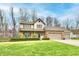 Charming two-story home with a well-maintained lawn and three-car garage at 381 Stoneybrook Grove Dr, Greenwood, IN 46142