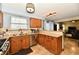 This kitchen features stainless steel appliances, stone countertops, and light wood cabinets at 381 Stoneybrook Grove Dr, Greenwood, IN 46142