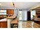 This kitchen features stone countertops and a bar area with seating near a sliding glass door at 381 Stoneybrook Grove Dr, Greenwood, IN 46142