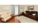 Comfortable living room with a decorative rug, a soft armchair, and natural lighting at 381 Stoneybrook Grove Dr, Greenwood, IN 46142