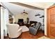 Comfortable living room with a ceiling fan, hardwood floors, and a stone fireplace at 381 Stoneybrook Grove Dr, Greenwood, IN 46142