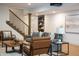 Finished basement featuring a seating area with modern decor and a staircase with an iron railing at 3899 Chapel Hill Ct, Bargersville, IN 46106