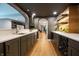 Basement with wet bar, gray cabinets, wood accents, and stainless steel appliances at 3899 Chapel Hill Ct, Bargersville, IN 46106