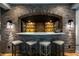 Finished basement with brick bar area, pendant lighting, and seating for four at 3899 Chapel Hill Ct, Bargersville, IN 46106