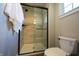 Bathroom featuring a glass-enclosed shower with a tile surround, modern fixtures, and a neutral color palette at 3899 Chapel Hill Ct, Bargersville, IN 46106