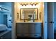 Bathroom featuring a dual vanity with a framed mirror and modern lighting, showcasing a clean and bright design at 3899 Chapel Hill Ct, Bargersville, IN 46106