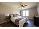 Bedroom featuring a bed with white linens and a decorative throw blanket and a ceiling fan at 3899 Chapel Hill Ct, Bargersville, IN 46106