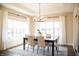 Dining room boasting natural light, modern lighting, a wooden table, and seating for six at 3899 Chapel Hill Ct, Bargersville, IN 46106