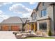 Inviting exterior view of home, showcasing the brick and stone facade and three-car garage at 3899 Chapel Hill Ct, Bargersville, IN 46106