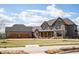 Stunning two-story home featuring an attached three-car garage and a welcoming front porch at 3899 Chapel Hill Ct, Bargersville, IN 46106