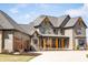 Charming home featuring a three-car garage, stone details, and an inviting front porch at 3899 Chapel Hill Ct, Bargersville, IN 46106