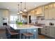 Stylish kitchen features large island with barstool seating and modern, stainless steel appliances at 3899 Chapel Hill Ct, Bargersville, IN 46106