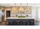 Spacious kitchen showcasing a large island with barstool seating and custom cabinetry at 3899 Chapel Hill Ct, Bargersville, IN 46106