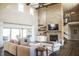 Bright, airy living room with stone fireplace, high ceilings, and open access to backyard patio at 3899 Chapel Hill Ct, Bargersville, IN 46106