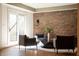 Basement living room with brick accent wall, modern furniture, and natural light at 3899 Chapel Hill Ct, Bargersville, IN 46106