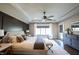 Serene main bedroom featuring a tray ceiling, and a large window with soft, natural light at 3899 Chapel Hill Ct, Bargersville, IN 46106