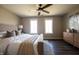 Spacious main bedroom with hardwood floors, a ceiling fan and bright windows at 3899 Chapel Hill Ct, Bargersville, IN 46106