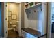 Well-organized mudroom with storage bench, coat hooks, and easy access to a convenient half bathroom at 3899 Chapel Hill Ct, Bargersville, IN 46106