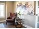 Cozy office nook with a leather armchair, modern artwork, hardwood floors, and natural light at 3899 Chapel Hill Ct, Bargersville, IN 46106