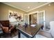 Comfortable home office with a leather chair, a wooden desk, hardwood floors, and french doors at 3899 Chapel Hill Ct, Bargersville, IN 46106