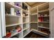 Organized pantry with built-in shelving providing ample storage for groceries and kitchen essentials at 3899 Chapel Hill Ct, Bargersville, IN 46106