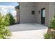Concrete patio area with neutral brick exterior and accent lighting at 3899 Chapel Hill Ct, Bargersville, IN 46106