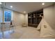 A well-lit play room with a teepee, whiteboard easel, and built-in shelving at 3899 Chapel Hill Ct, Bargersville, IN 46106