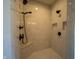 This walk-in shower has a bench, handheld sprayer, showerhead, and white subway tile at 3899 Chapel Hill Ct, Bargersville, IN 46106