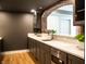Modern wet bar features gray cabinets, stainless steel appliances, and quartz countertops at 3899 Chapel Hill Ct, Bargersville, IN 46106