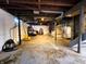 Unfinished basement with cement walls and exposed pipes at 3949 Fletcher Ave, Indianapolis, IN 46203