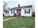 Charming single-Gathering home with a well-manicured lawn and a cozy front porch at 3949 Fletcher Ave, Indianapolis, IN 46203