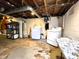 Laundry room with a washer and dryer and exposed rafters at 3949 Fletcher Ave, Indianapolis, IN 46203