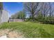 Spacious backyard with a wooden fence and green grass at 4363 Rhapsody Ln, Indianapolis, IN 46235